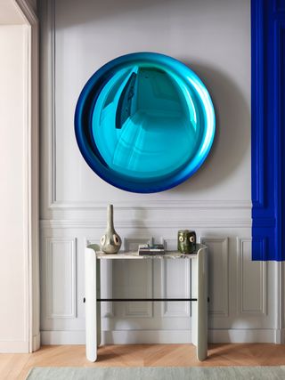 a blue tinted mirror in a hallway
