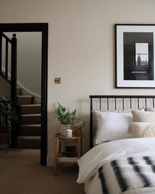 cream bedroom with black and white skirting board
