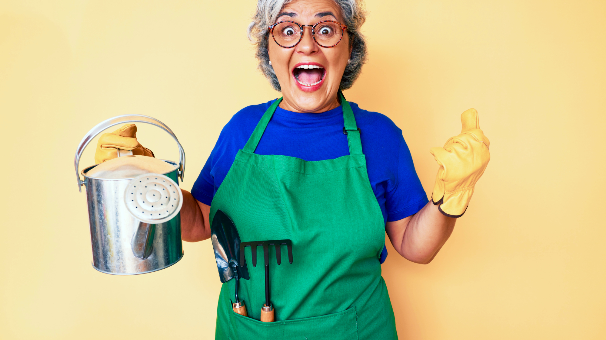 excited gardener with watering can and tools