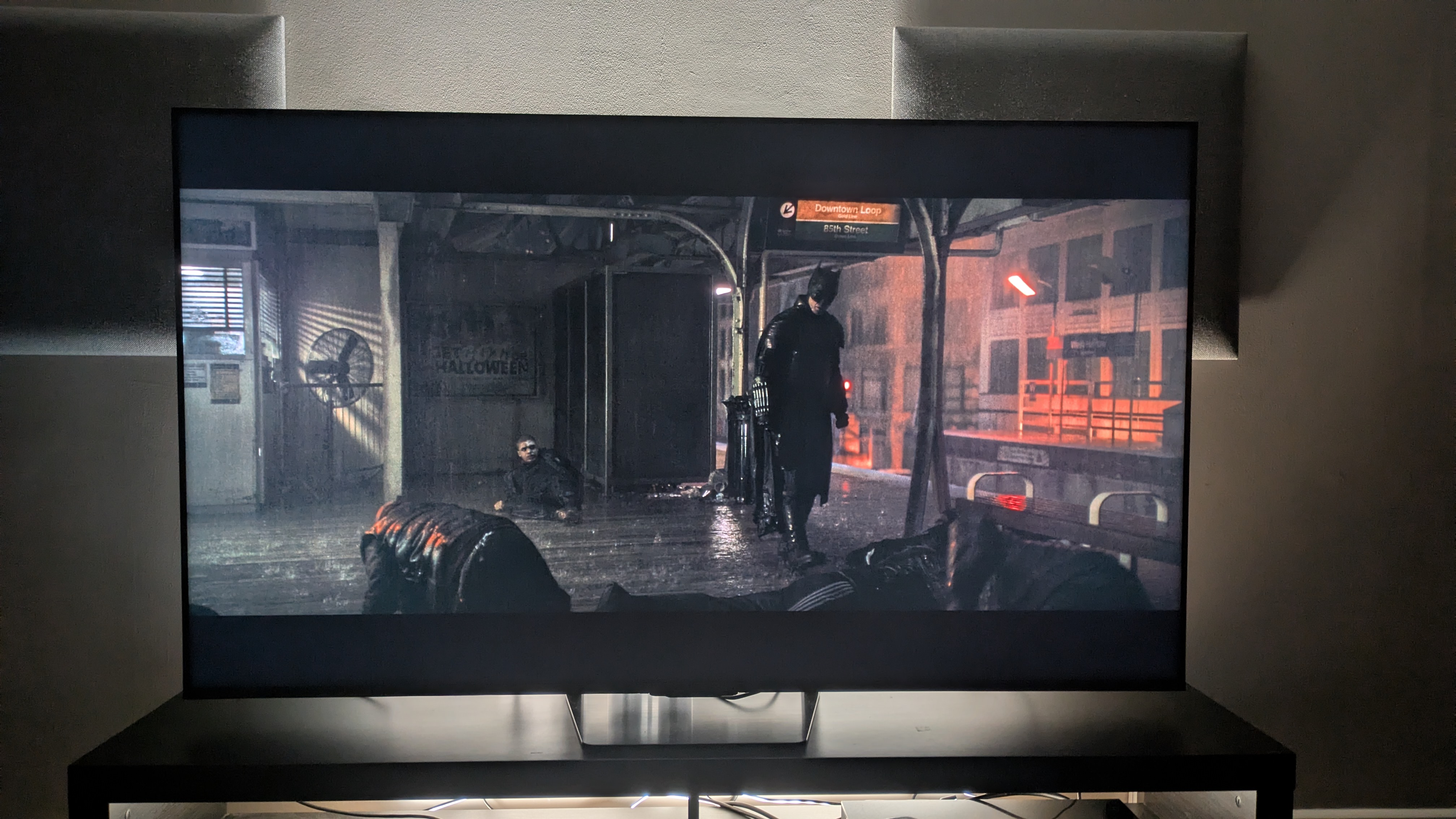 Hisense UR8 showing Batman on a subway platform. The TV shows strong contrast with good detail