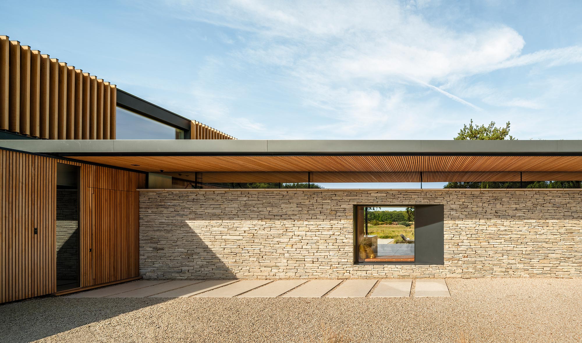 meadow house, a modernist inspired pavilion like house structure in the flat English countryside