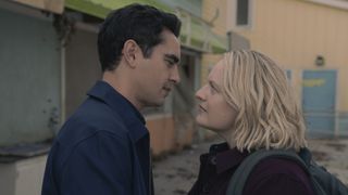 June Osborne (Elisabeth Moss) and Commander Nick Blaine (Max Minghella) stand face to face in The Handmaid's Tale season 6