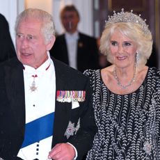 Queen Camilla and King Charles III arrive at a reception and dinner in honour of their Coronation on October 18, 2023 in London, England.