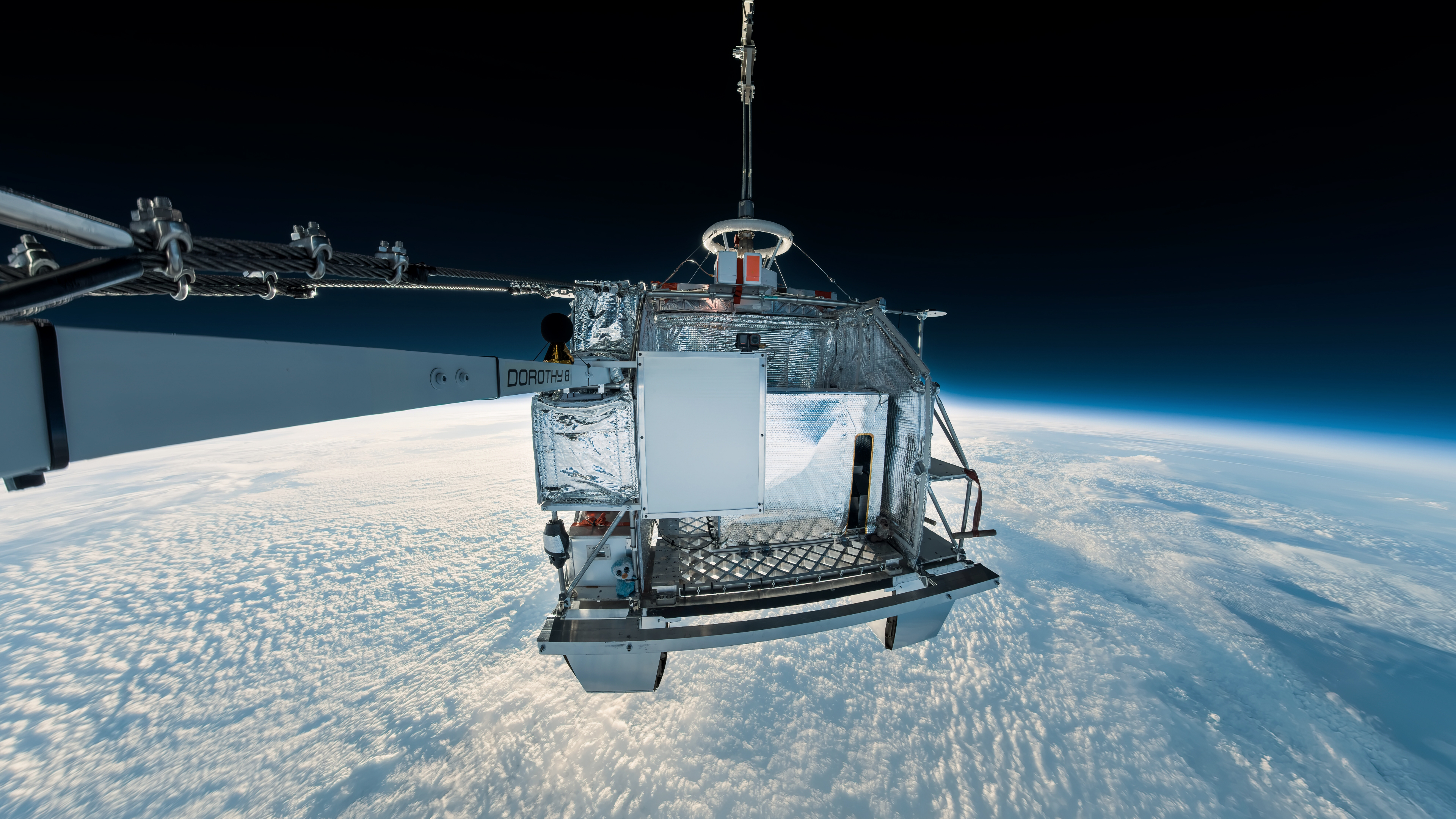 Gondala of Dorothy 8 mission with planet Earth below