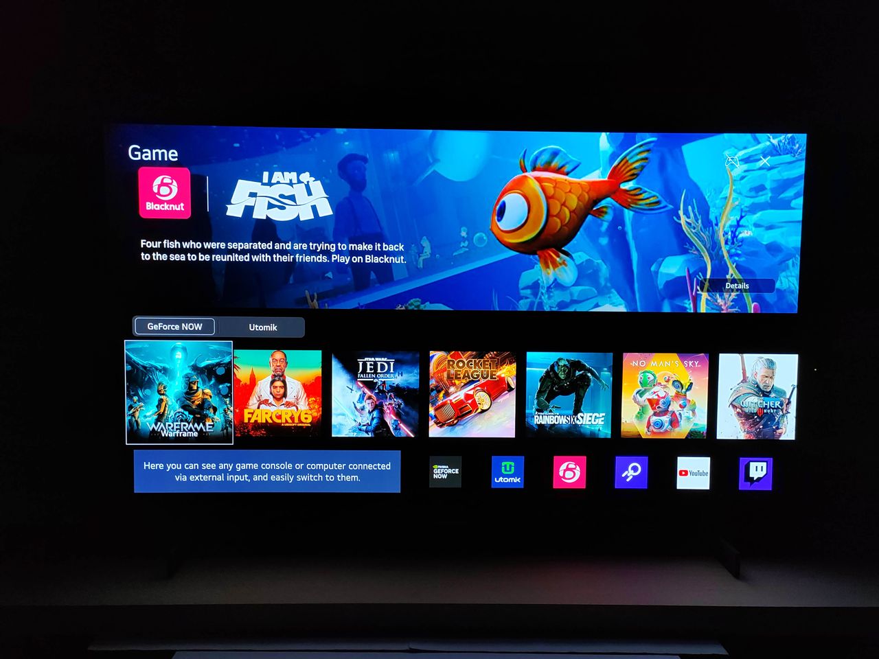 LG OLED C3 in a dark room with smart menu displayed