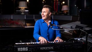 Gary Barlow sat playing the keyboard for BBC Maestro songwriting lessons