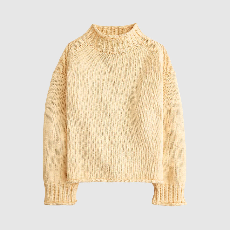 Cream rollneck sweater.