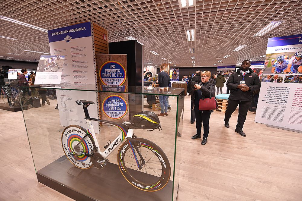 Specators and fans mingle during the team press conference at the Quick-Step Floors Pop-Up Store in the Ring Shopping Center in Kortrijk