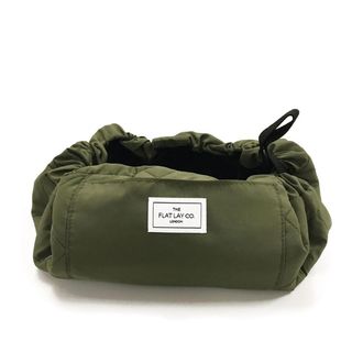 A green coloured Flat Lay Co makeup bag is one of the best Christmas beauty gifts for her.