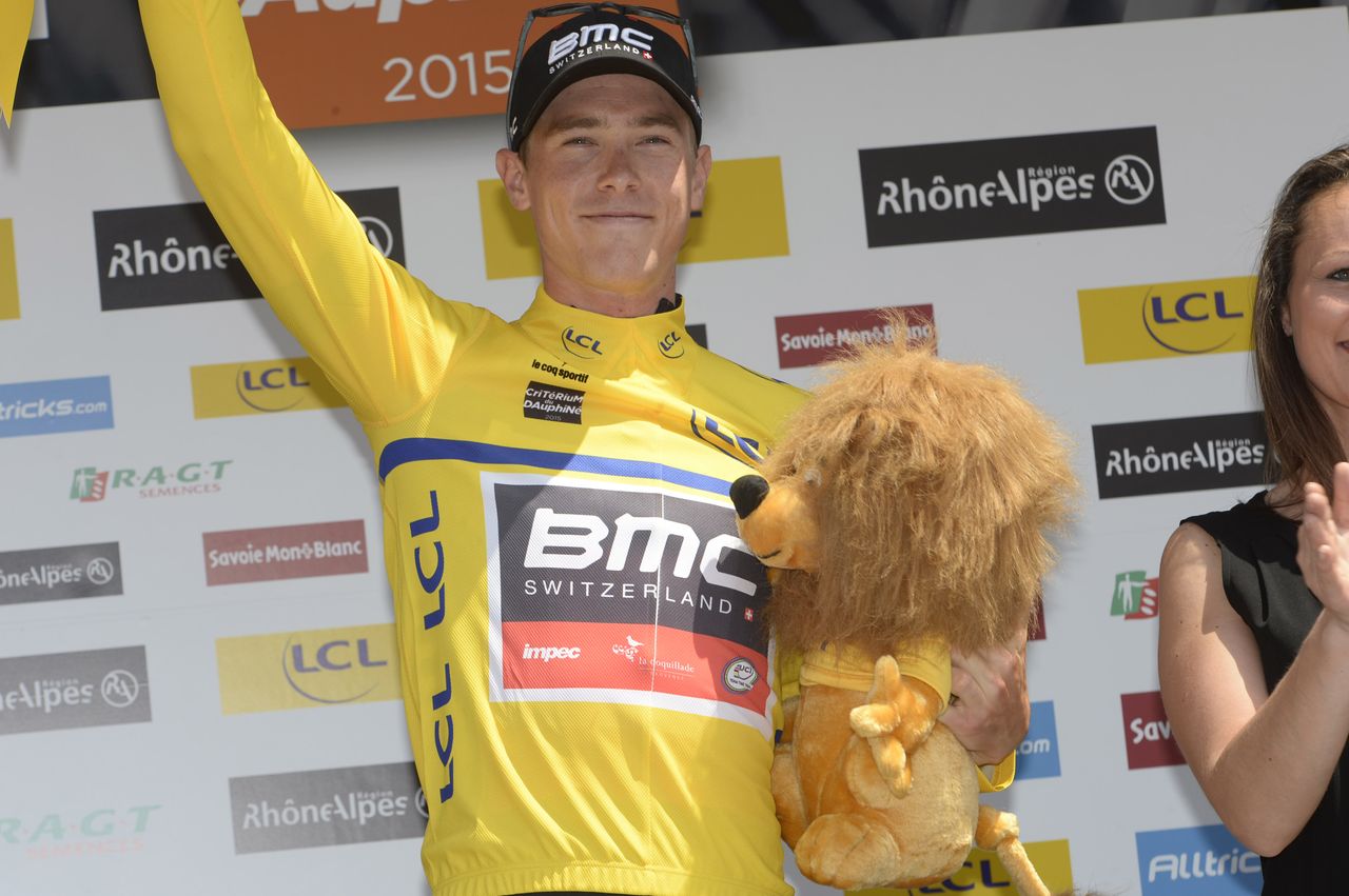 New race leader Rohan Dennis celebrates atop the podium