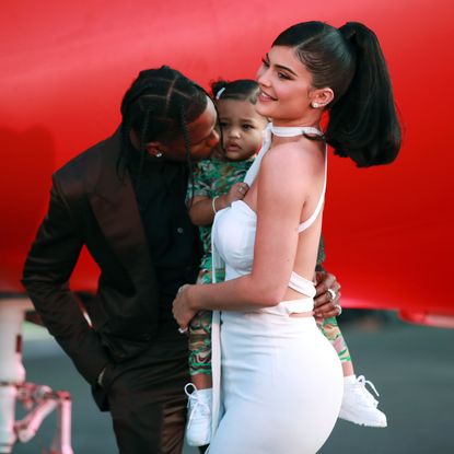 santa monica, california august 27 l r travis scott, stormi webster, and kylie jenner attend the premiere of netflixs travis scott look mom i can fly at barker hangar on august 27, 2019 in santa monica, california photo by rich furygetty images