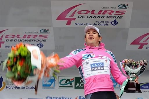 Alex Rasmussen (Saxo Bank) hoists his winners bouquet into the crowd in Ypres