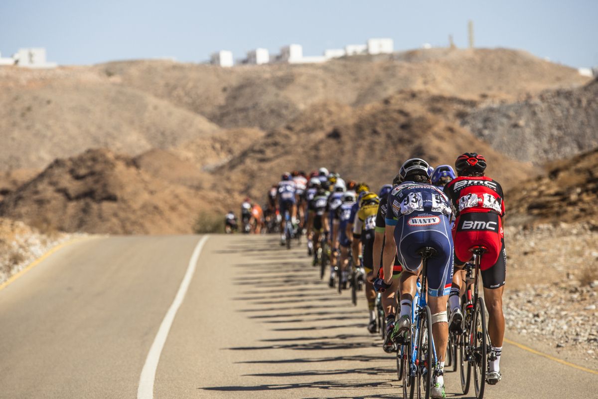 The peloton rolling through the Oman landscape