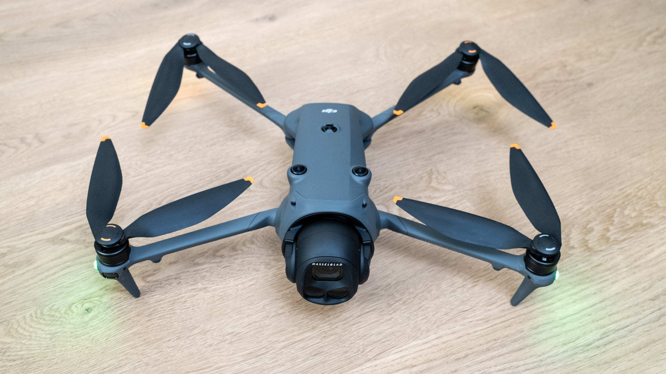 DJI Mavic 4 Pro on a wooden floor ready for flight