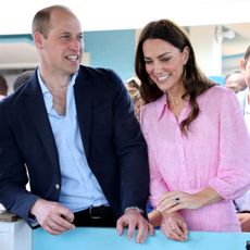 Prince William and Kate Middleton smile together during their official tour of Belize, Jamaica and the Bahamas