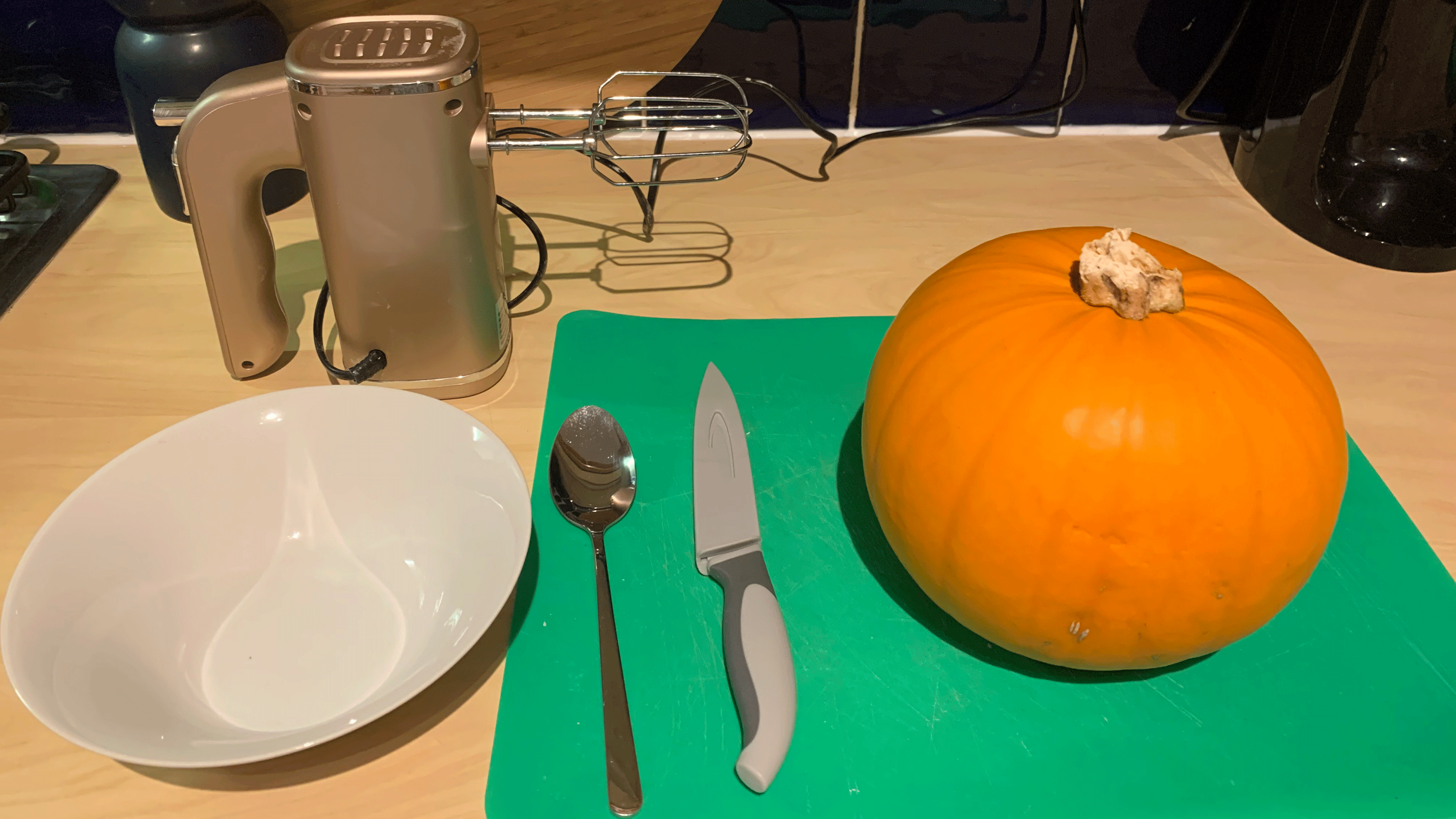 Pumpkin with knife and spoon