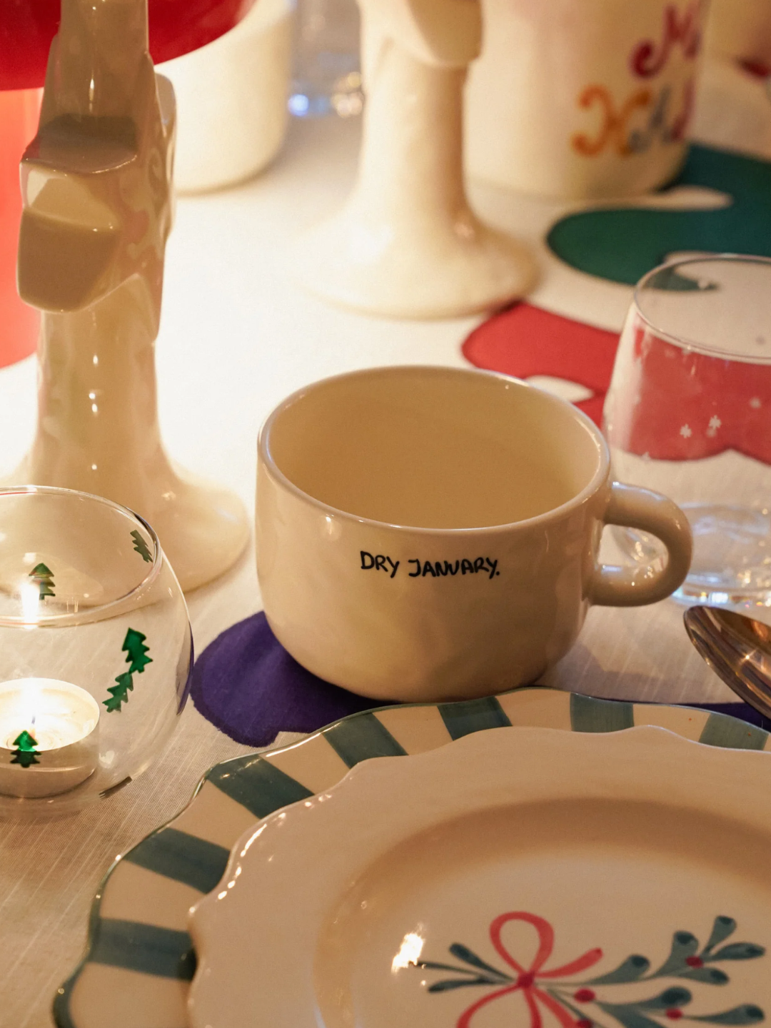 A ceramic mug reading 'dry January' in black lettering from Anna + Nina