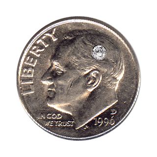 one side of a silver dime with a man's face and the word Liberty