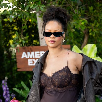 Rihanna wearing sunglasses and posing