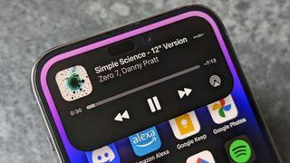 iPhone 14 Pro Dynamic Island showing Music