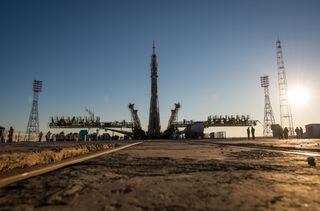 The Soyuz TMA-11M rocket is erected into position after being rolled out to the launch pad by train on Tuesday, Nov. 5, 2013, at the Baikonur Cosmodrome in Kazakhstan.