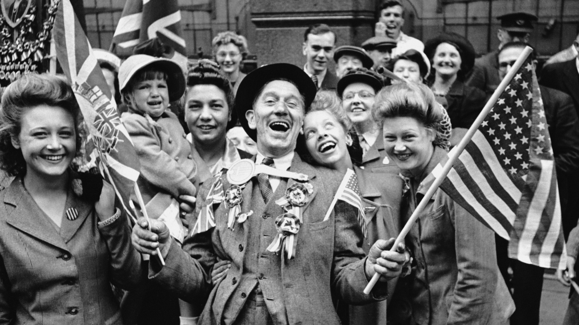 Ecstatic crowds celebrating VE Day in London's Piccadilly, at the end of World War II,