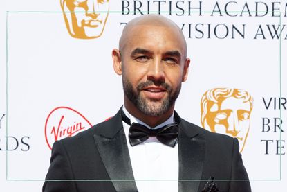 Alex Beresford wearing a suit