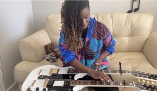 Yasmin Williams plays a Gibson EDS-1275 doubleneck guitar
