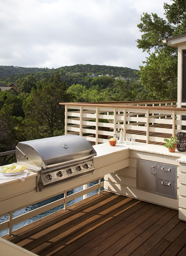 A built in grill installed on a ledge, as an extension to the home's terrace
