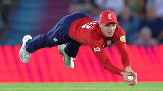 Harry Brook diving forward takes a catch off the bowling of Adil Rashid to dismiss Romario Shepherd of West Indies during the 3rd Vitality IT20 match between England and West Indies at Utilita Bowl on June 10