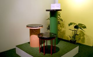 Combining polished granite with bold blocks of brightly lacquered steel, this trio of circular pedestal tables by young Norwegian design studio Vera & Kyte was displayed alongside a collection of pot plants on the studio's stand at Tent London