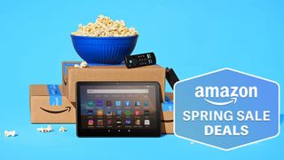 Amazon Fire Tablet and Fire TV Stick shown next to Amazon boxes