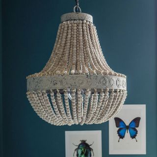chandelier blue wall with pictures and bulb