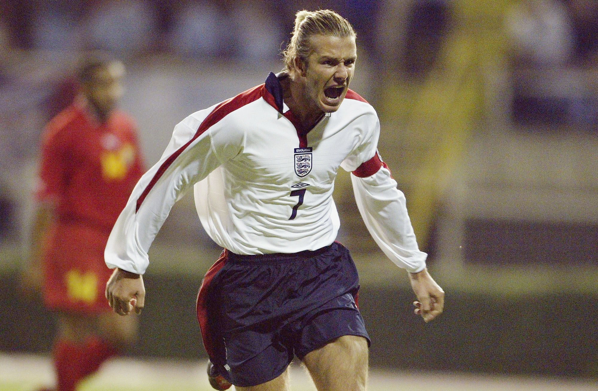 David Beckham celebrates after scoring a penalty for England against Macedonia in a Euro 2004 qualifier in September 2003.