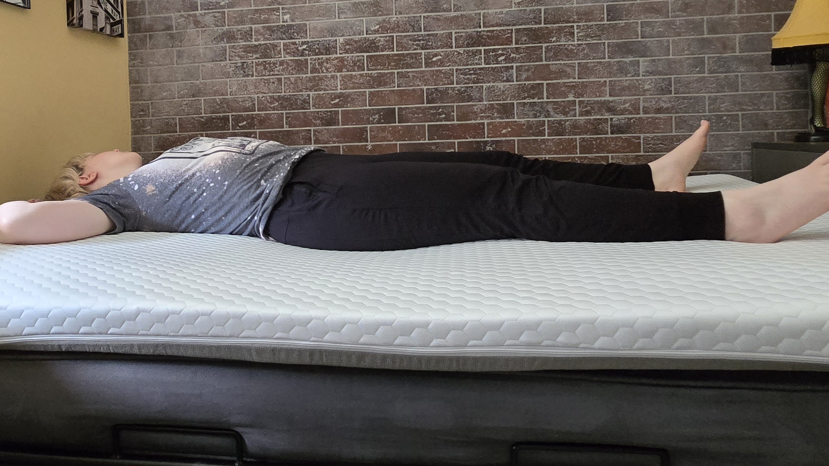 Sleep tester rests in position on the Helix ErgoAlign Mattress Topper.