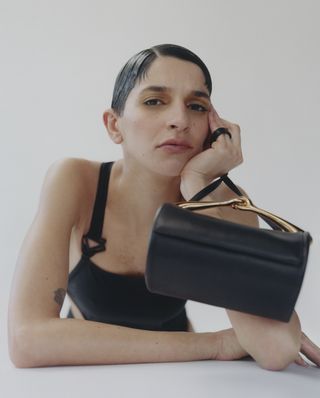 Model with black bag