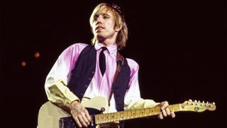 American Rock and Pop musician Tom Petty (1950 - 2017) plays guitar as he leads his band, the Heartbreakers, during a performance on the 'Long After Dark' tour at Nassau Coliseum, Uniondale, New York, March 31, 1983. 