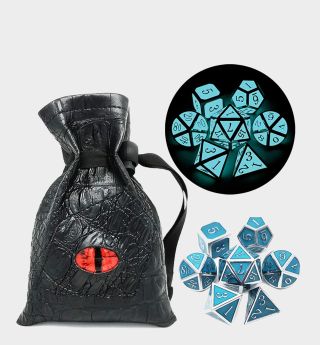 DnD glow in the dark dice beside a leather-effect bag with a glowing red eye against a plain background