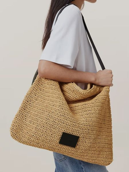 Woman carrying shoulder woven bag