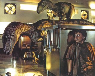 Actor Joseph Mazzello hiding from dinosaurs in Jurassic Park