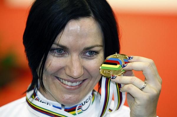 Anna Meares (Australia) proudly shows off her 500m time trial gold medal.
