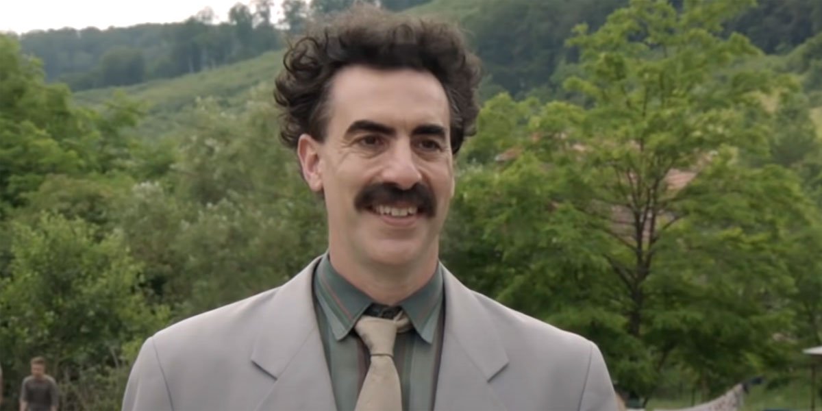 Borat smiling and ready to head to America again.