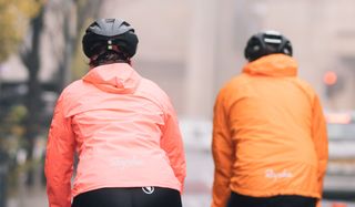 Close up of two commuters wearing waterproof jackets
