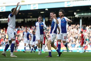 Adam Wharton of Blackburn Rovers celebrates with teammates after scoring their side's second goal during the Sky Bet Championship between Blackburn Rovers and Birmingham City at Ewood Park on October 22, 2022 in Blackburn, England.