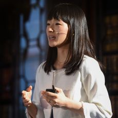 marie kondo speaking with white top and black hair