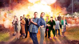 The key art for Apocalypse Slough, showing the cast standing in front of a rugby club that is exploding and bursting into flames. From left to right: Sanjeev Bhaskar, Gemma Jones, Jim Howick, Ben Bailey Smith, Simon Day, Johnny Vegas, Sian Gibson, Shaun Williamson, Sarah Hadland, Annette Badland, Matthew Kelly and Charlie Hardwick