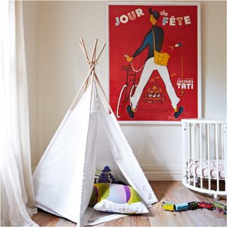 childrens room with bright artwork and white wall