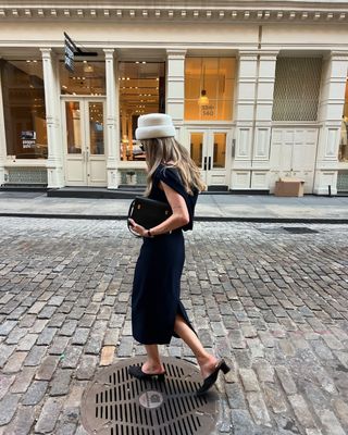 @elizagracehuber wearing black dress, black heels, and white hat