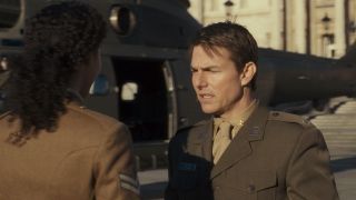 Tom Cruise by a helicopter in Edge of Tomorrow