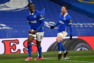 Danny Welbeck of Brighton & Hove Albion celebrates with Adam Lallana after scoring his team's first goal during the Premier League match between Brighton & Hove Albion and West Ham United at American Express Community Stadium on May 15, 2021 in Brighton, England. Sporting stadiums around the UK remain under strict restrictions due to the Coronavirus Pandemic as Government social distancing laws prohibit fans inside venues resulting in games being played behind closed doors.